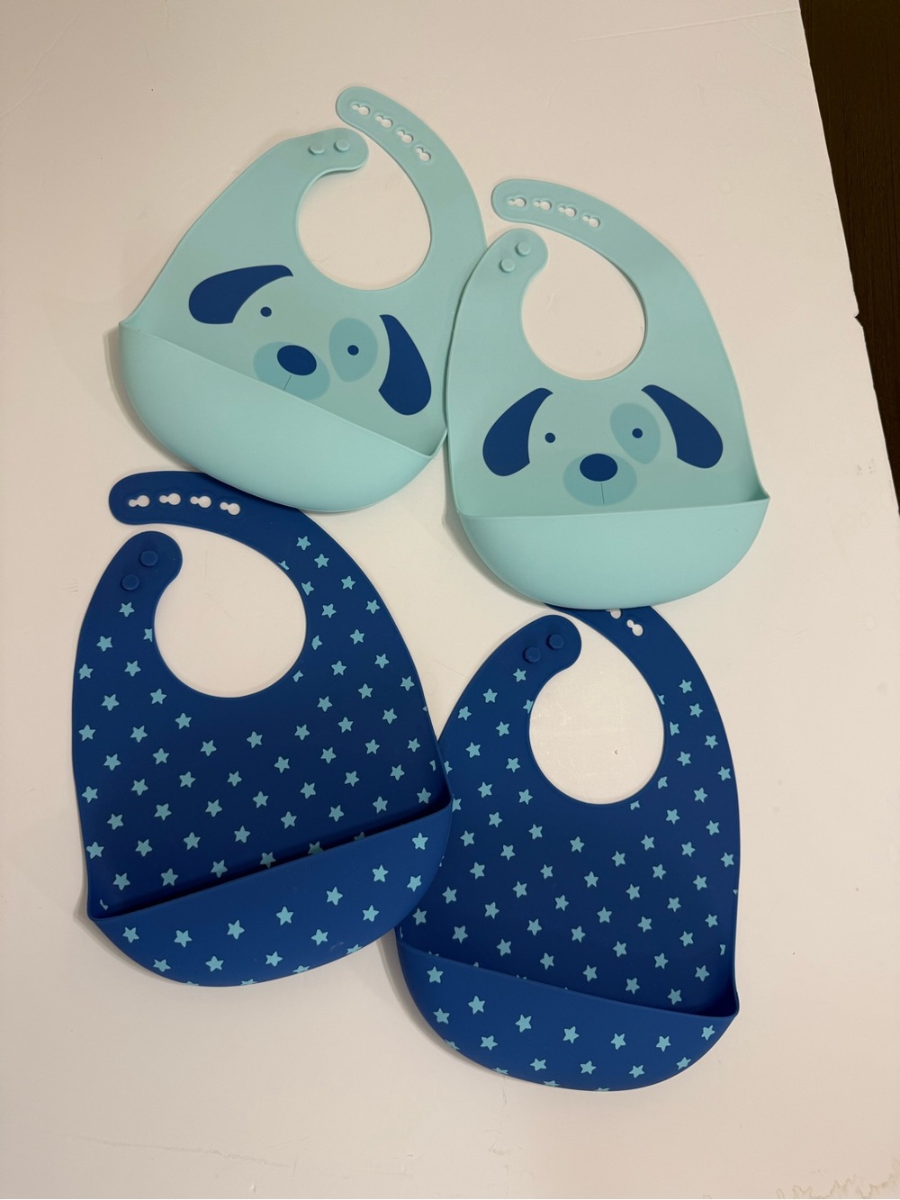 Silicone Baby Bibs 4-Pack in Light Blue and Navy with Puppy & Star Designs